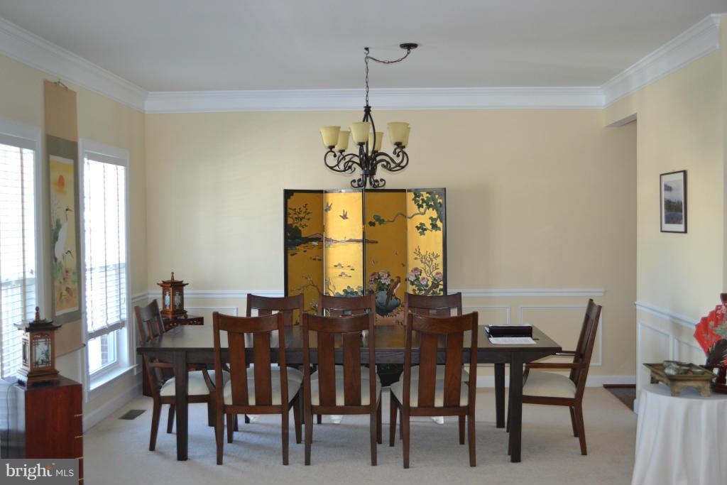 4145 Agency Loop Triangle, VA 22172 - Photo 2 of 24 a view of a dining room with furniture window and outside view