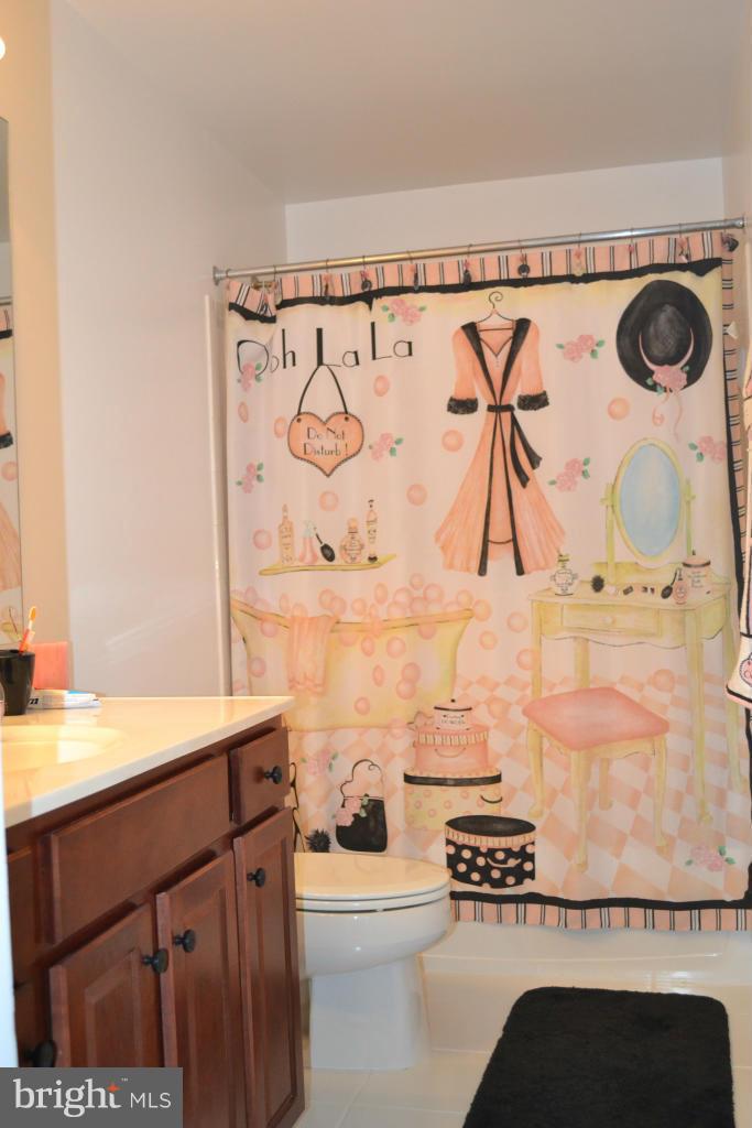 4145 Agency Loop Triangle, VA 22172 - Photo 12 of 24 a bathroom with a sink and a mirror