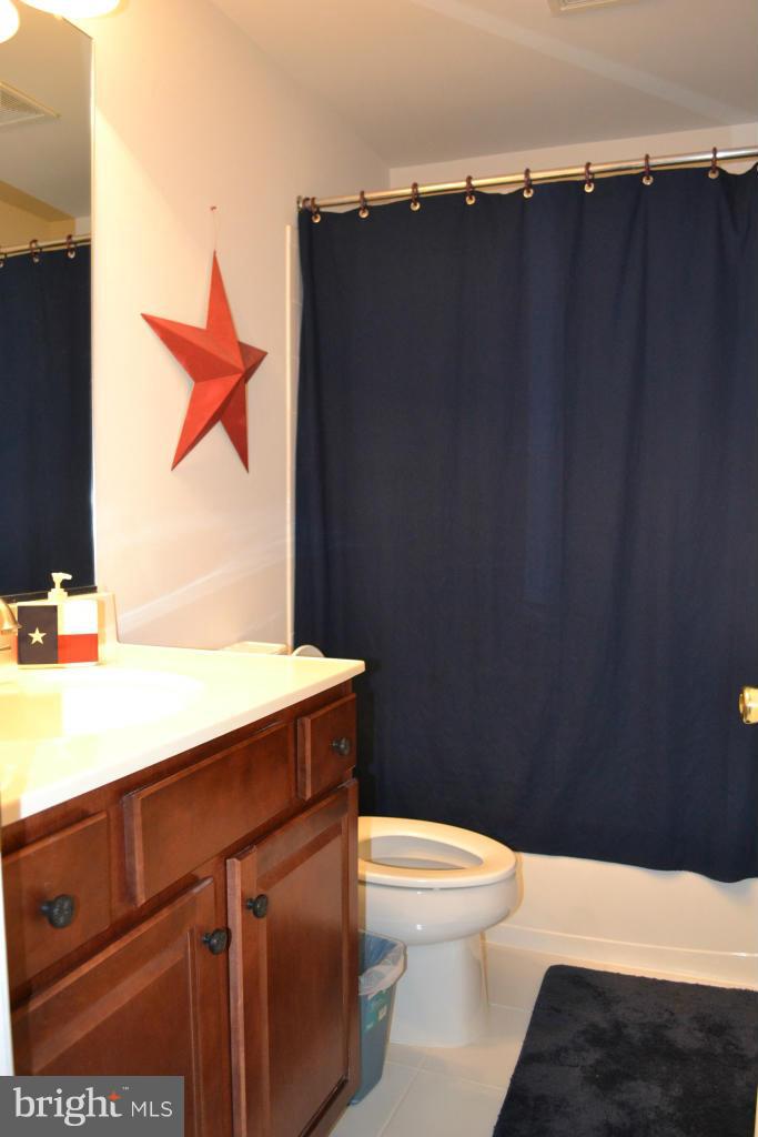 4145 Agency Loop Triangle, VA 22172 - Photo 19 of 24 a bathroom with a sink and a toilet