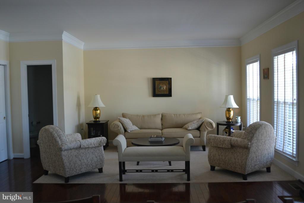 4145 Agency Loop Triangle, VA 22172 - Photo 3 of 24 a living room with furniture and a large window