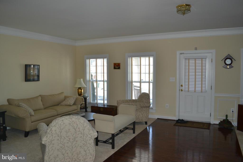4145 Agency Loop Triangle, VA 22172 - Photo 4 of 24 a living room with furniture and wooden floor