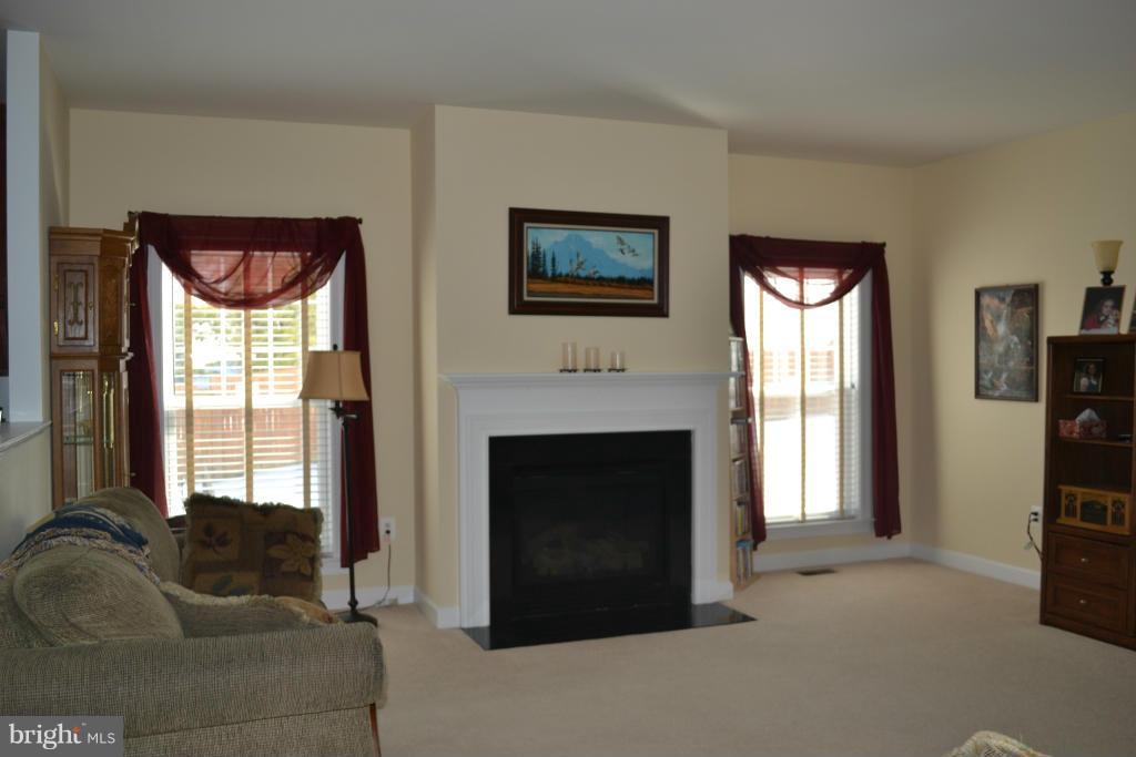 4145 Agency Loop Triangle, VA 22172 - Photo 9 of 24 a living room with furniture and a fireplace