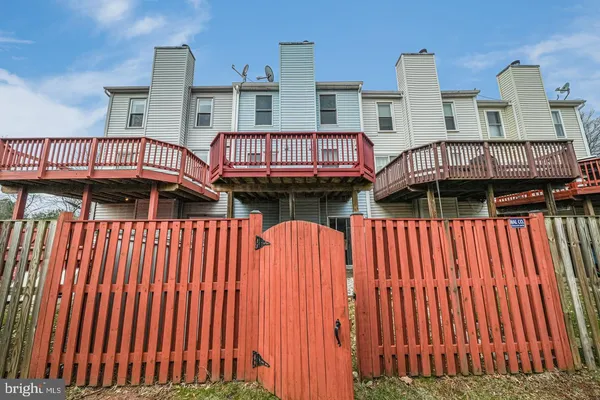 a view of a balcony with two chairs