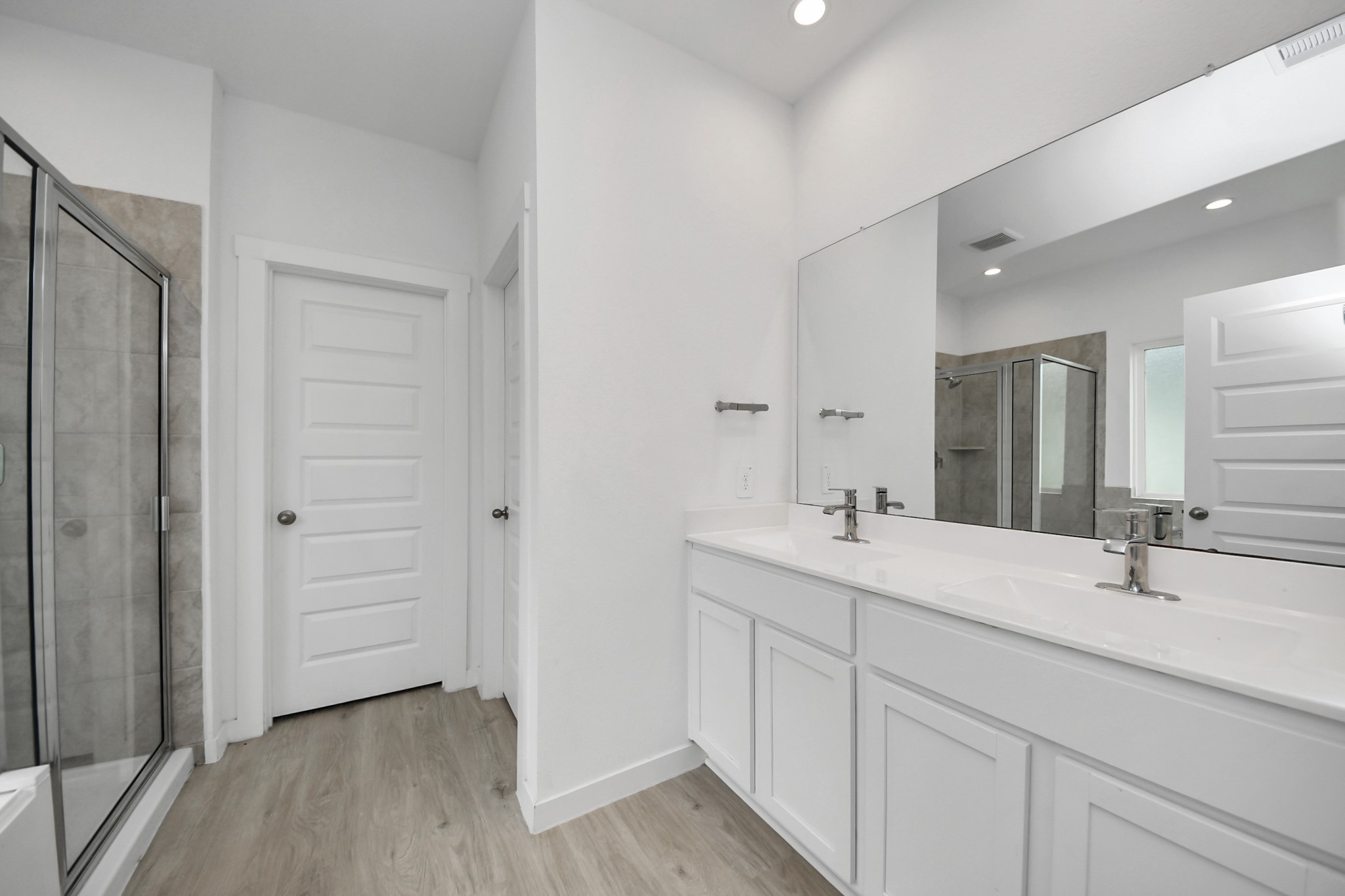 31738 Melkridge Road Fulshear, TX 77441 - Photo 19 of 33 This home will have the Upgraded Massive Walk in Shower that was made for Two! RevWood Surroundings and Custom Shampoo Niche! Never run out of Hot Water for those long Showers we have the Tankless Water Heater!