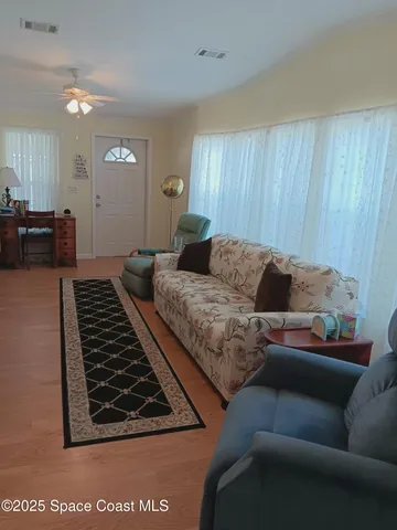 a kitchen with stainless steel appliances a stove a sink a microwave and a refrigerator