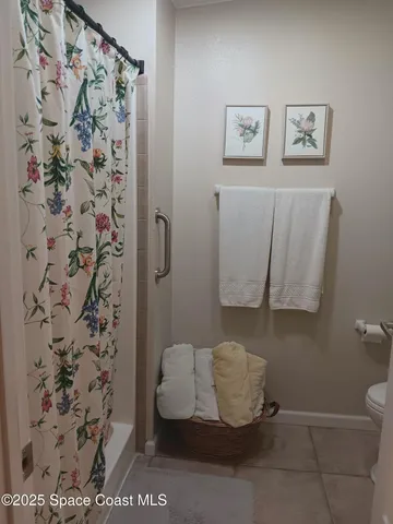 a bathroom with a sink mirror and toilet