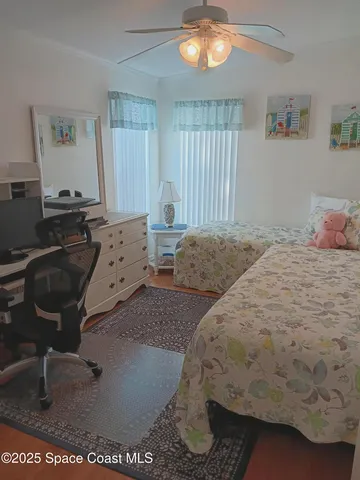 a bathroom with a toilet and a shower curtain