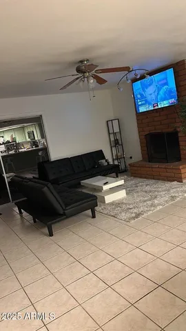 a living room with a couch and a fireplace