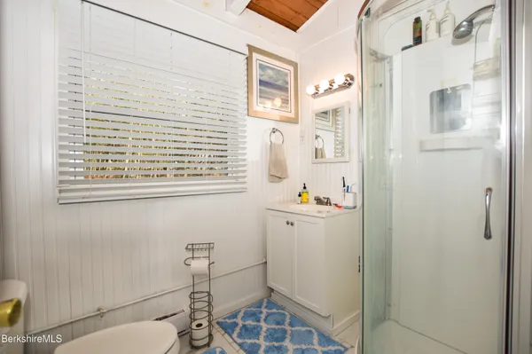 a view of a roof deck with potted plants and trees
