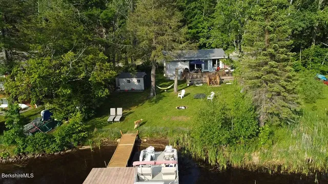 a view of lake with houses in the back
