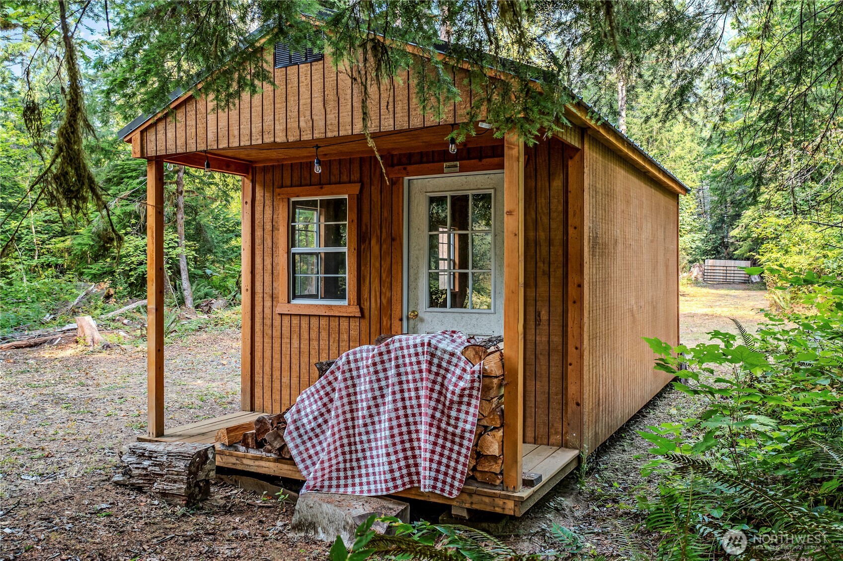 0 North Duckabush Road Brinnon, WA 98320 - Photo 25 of 29 a front view of a house with garden