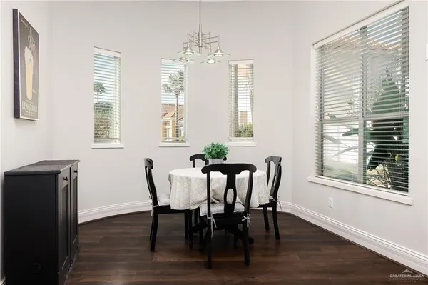 a view of a dining room with furniture and windows