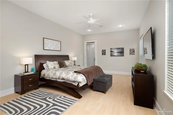 a bedroom with a bed and a couch