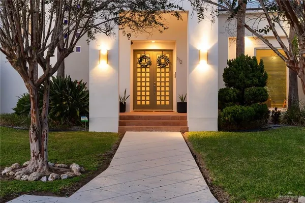a front view of a house with a yard