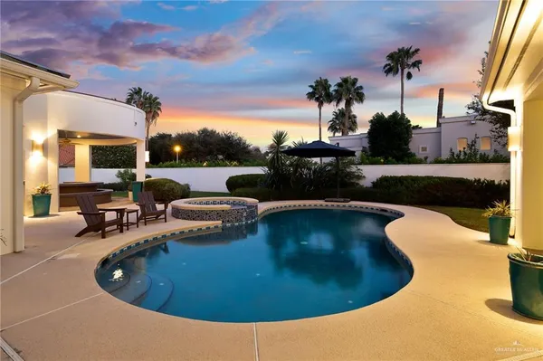 a view of a swimming pool with lounge chair