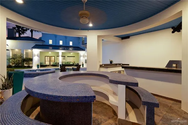 a kitchen with a stove and a refrigerator