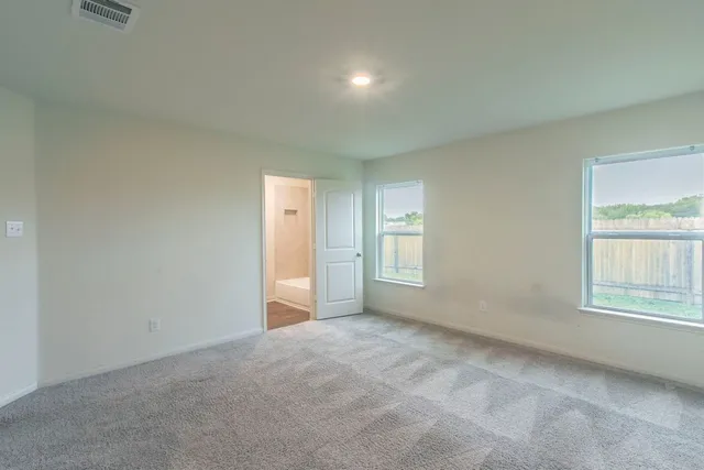 an empty room with a bathroom