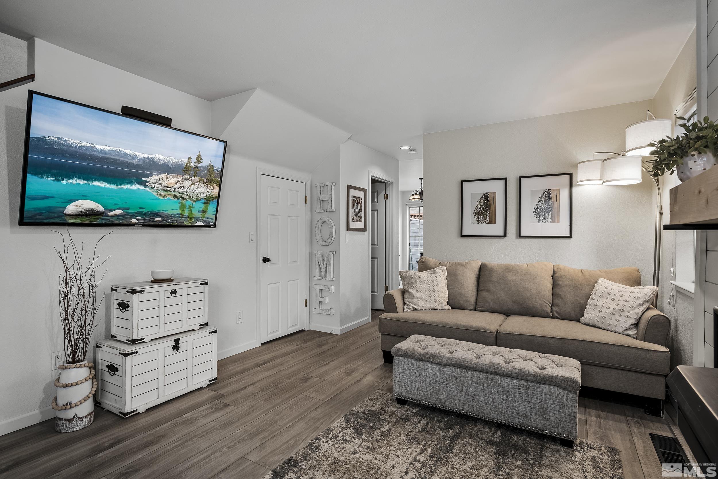 2650 Plumas Street, Unit 13 Reno, NV 89509 - Photo 7 of 23 a living room with furniture and a flat screen tv