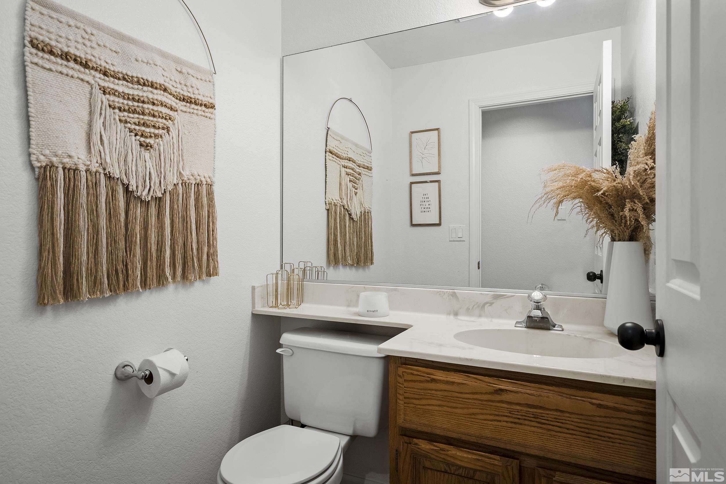 2650 Plumas Street, Unit 13 Reno, NV 89509 - Photo 8 of 23 a bathroom with a sink toilet and mirror