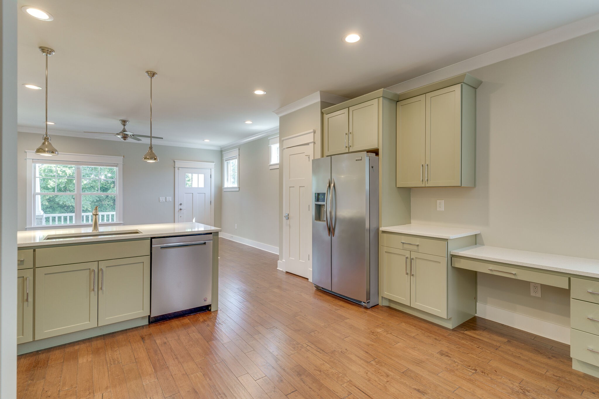 1711 Ridley Boulevard Nashville, TN 37203 - Photo 11 of 49 a large kitchen with cabinets and wooden floor