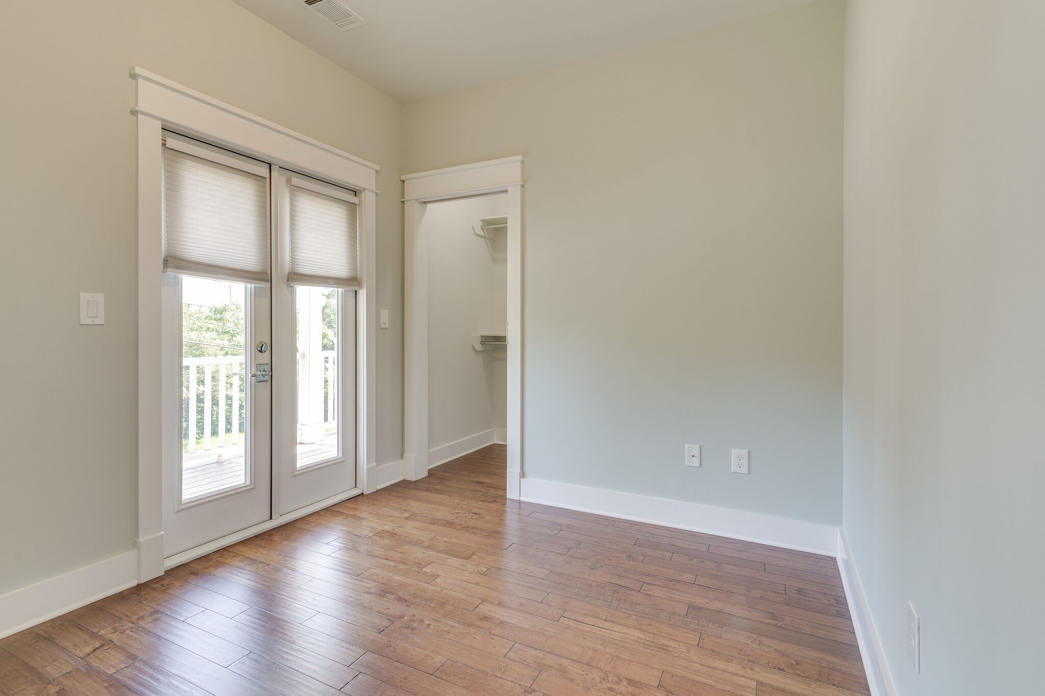1711 Ridley Boulevard Nashville, TN 37203 - Photo 20 of 49 an empty room with wooden floor and windows