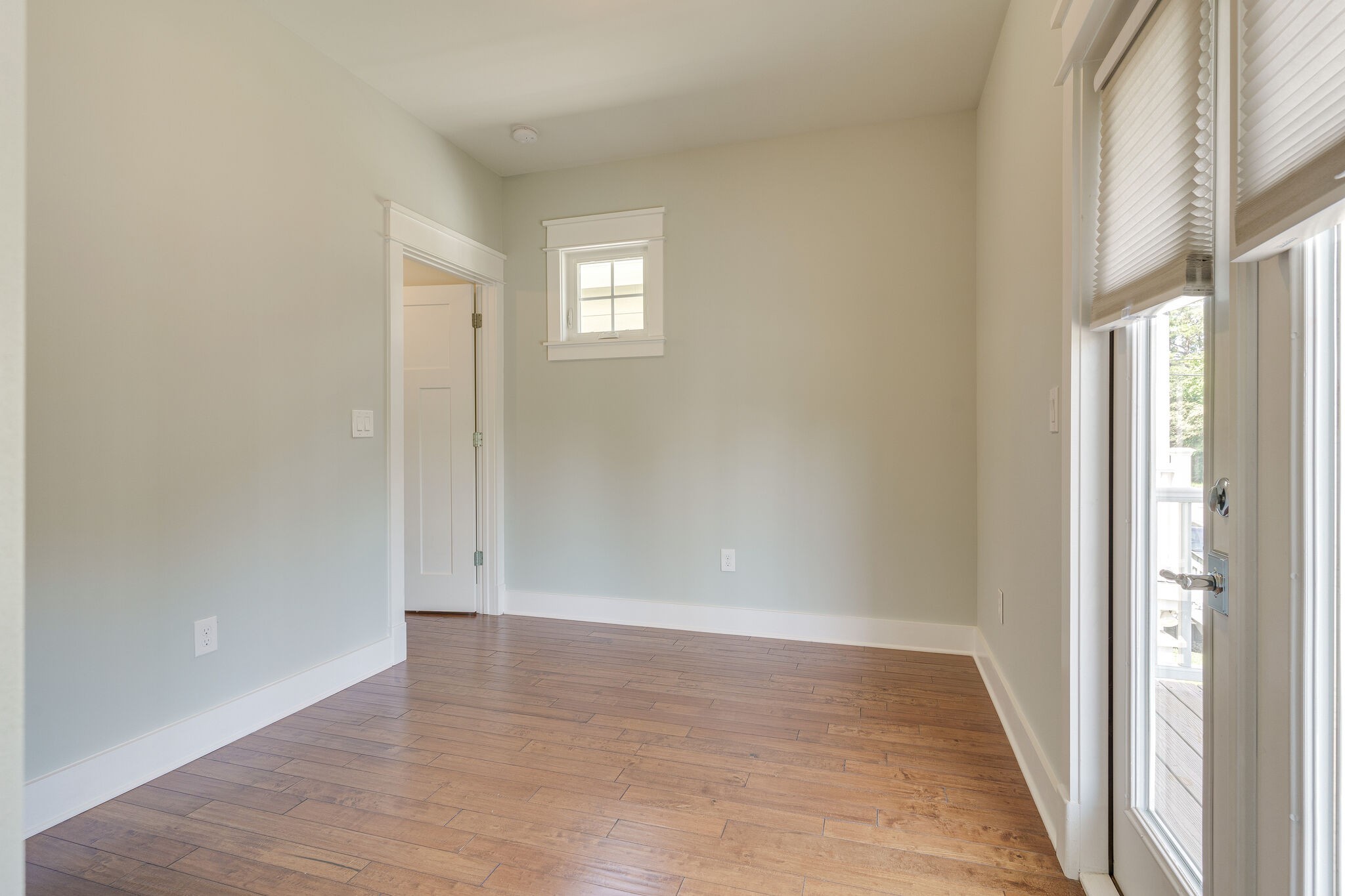 1711 Ridley Boulevard Nashville, TN 37203 - Photo 21 of 49 an empty room with wooden floor and windows