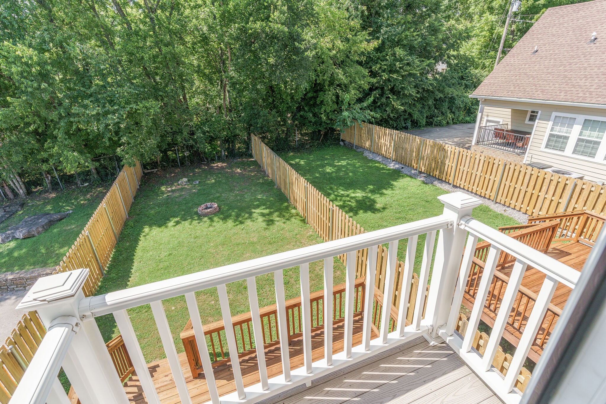 1711 Ridley Boulevard Nashville, TN 37203 - Photo 24 of 49 a view of a wooden deck and a yard with swimming pool