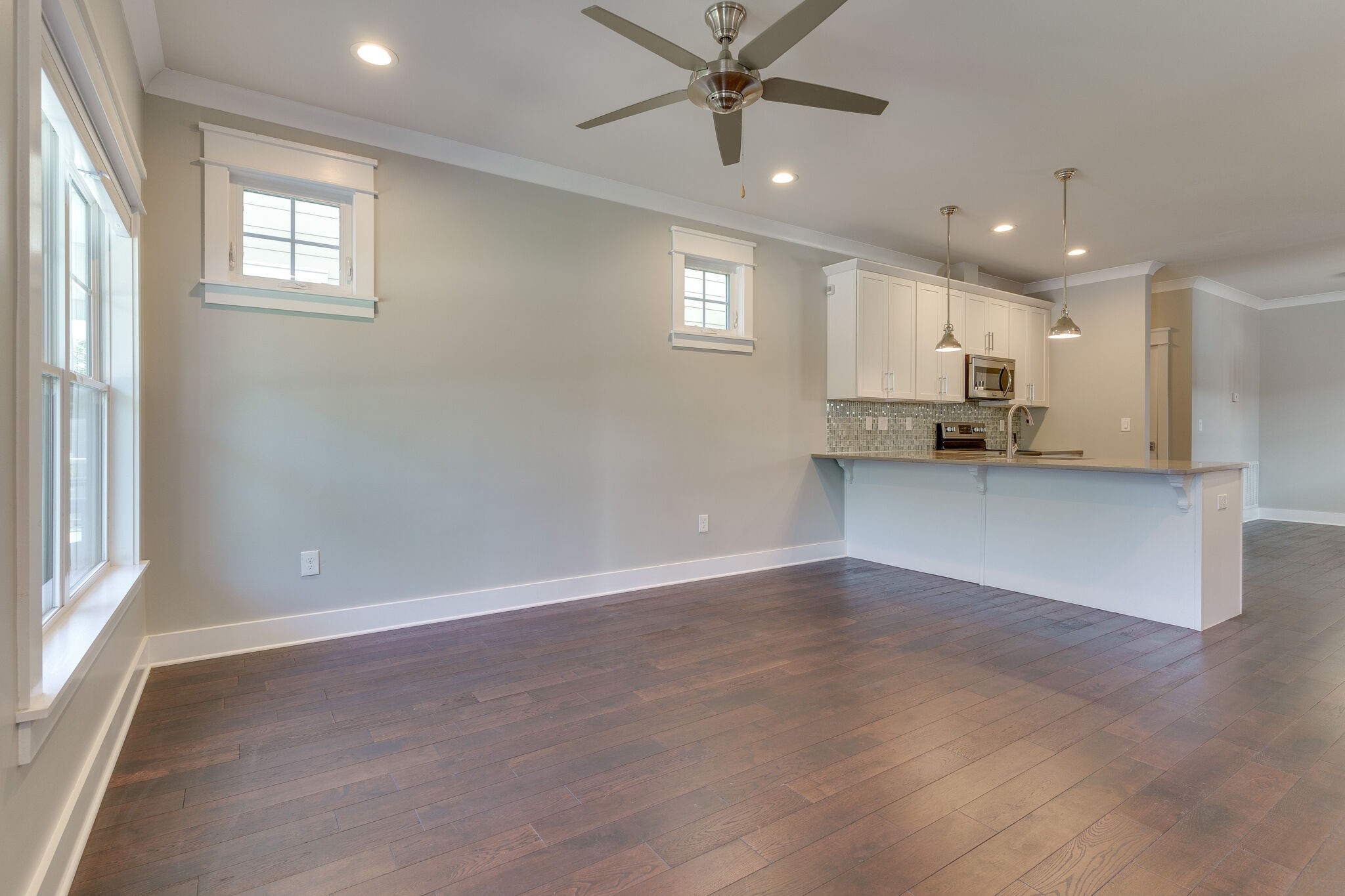 1711 Ridley Boulevard Nashville, TN 37203 - Photo 27 of 49 an empty room with wooden floor and windows
