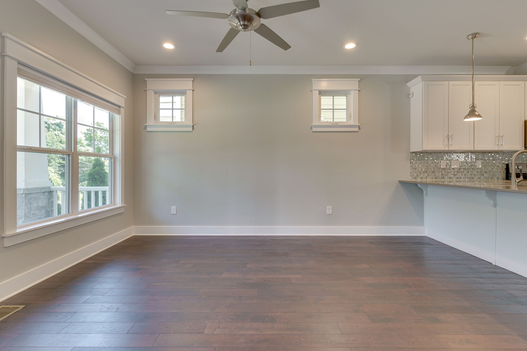 1711 Ridley Boulevard Nashville, TN 37203 - Photo 28 of 49 an empty room with wooden floor and windows