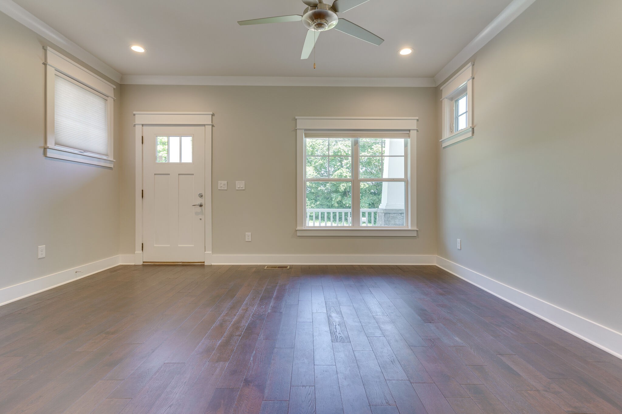 1711 Ridley Boulevard Nashville, TN 37203 - Photo 29 of 49 an empty room with wooden floor and windows