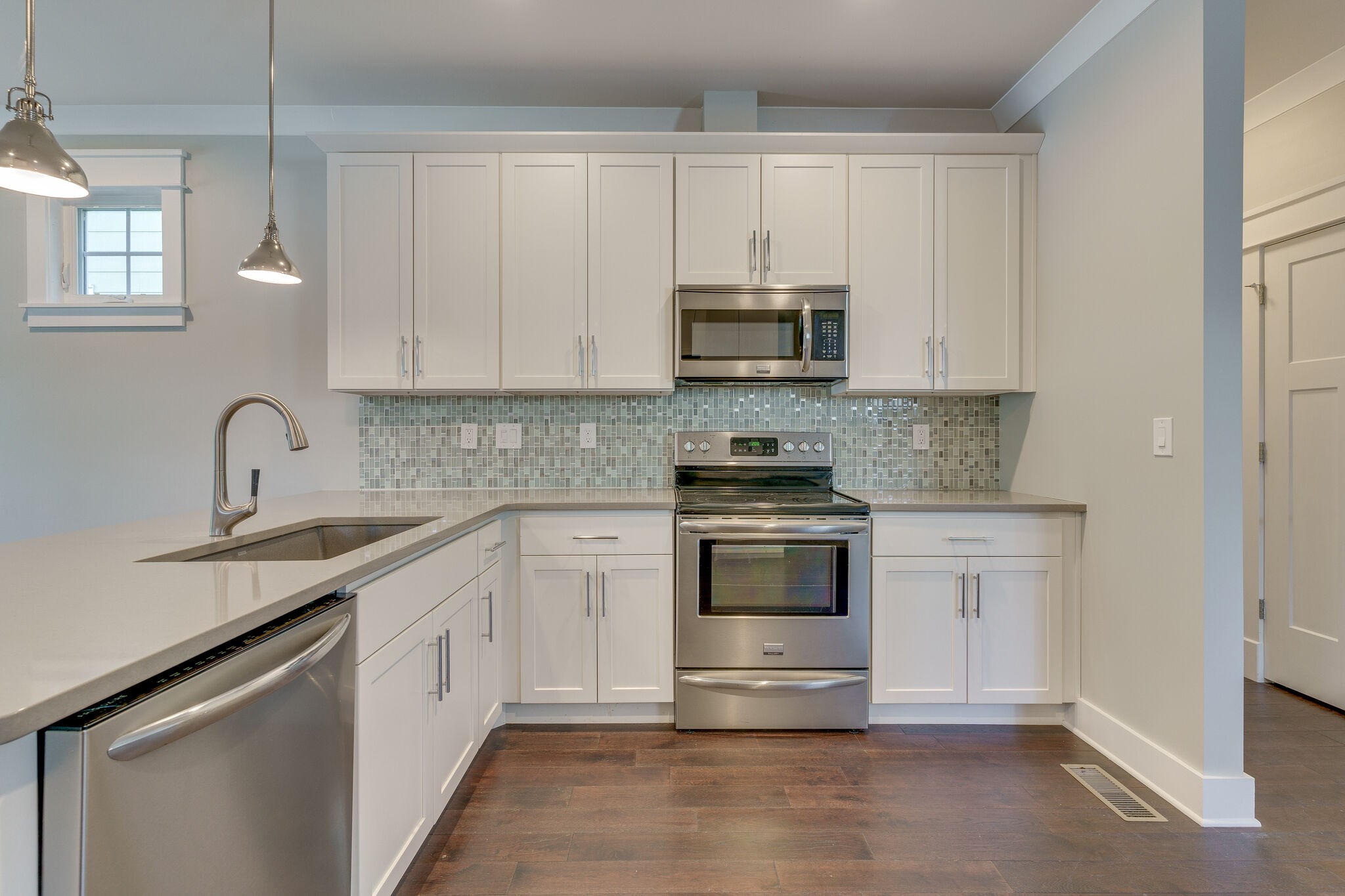 1711 Ridley Boulevard Nashville, TN 37203 - Photo 34 of 49 a kitchen with stainless steel appliances granite countertop a sink stove and microwave