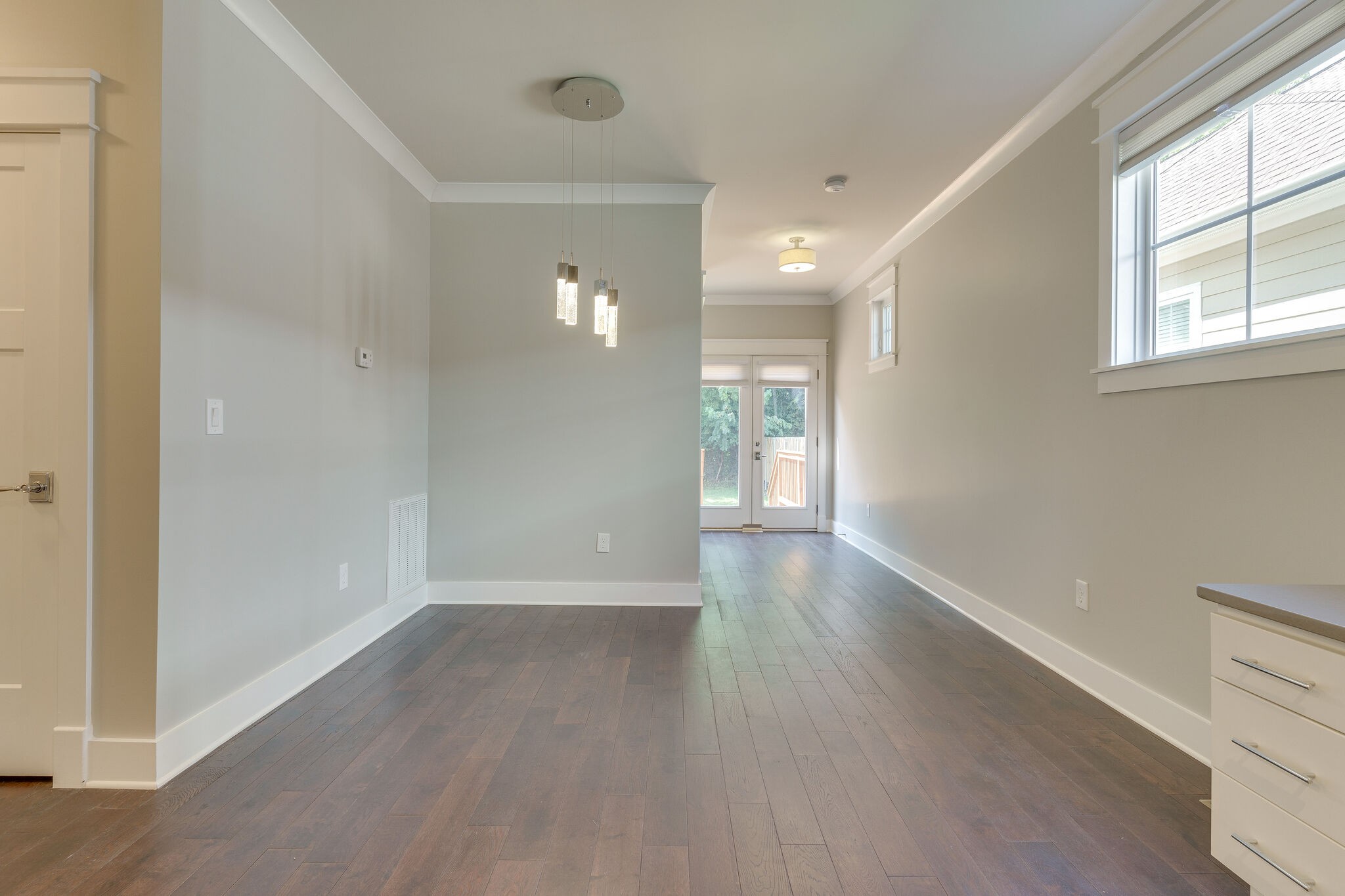1711 Ridley Boulevard Nashville, TN 37203 - Photo 37 of 49 an empty room with wooden floor and windows