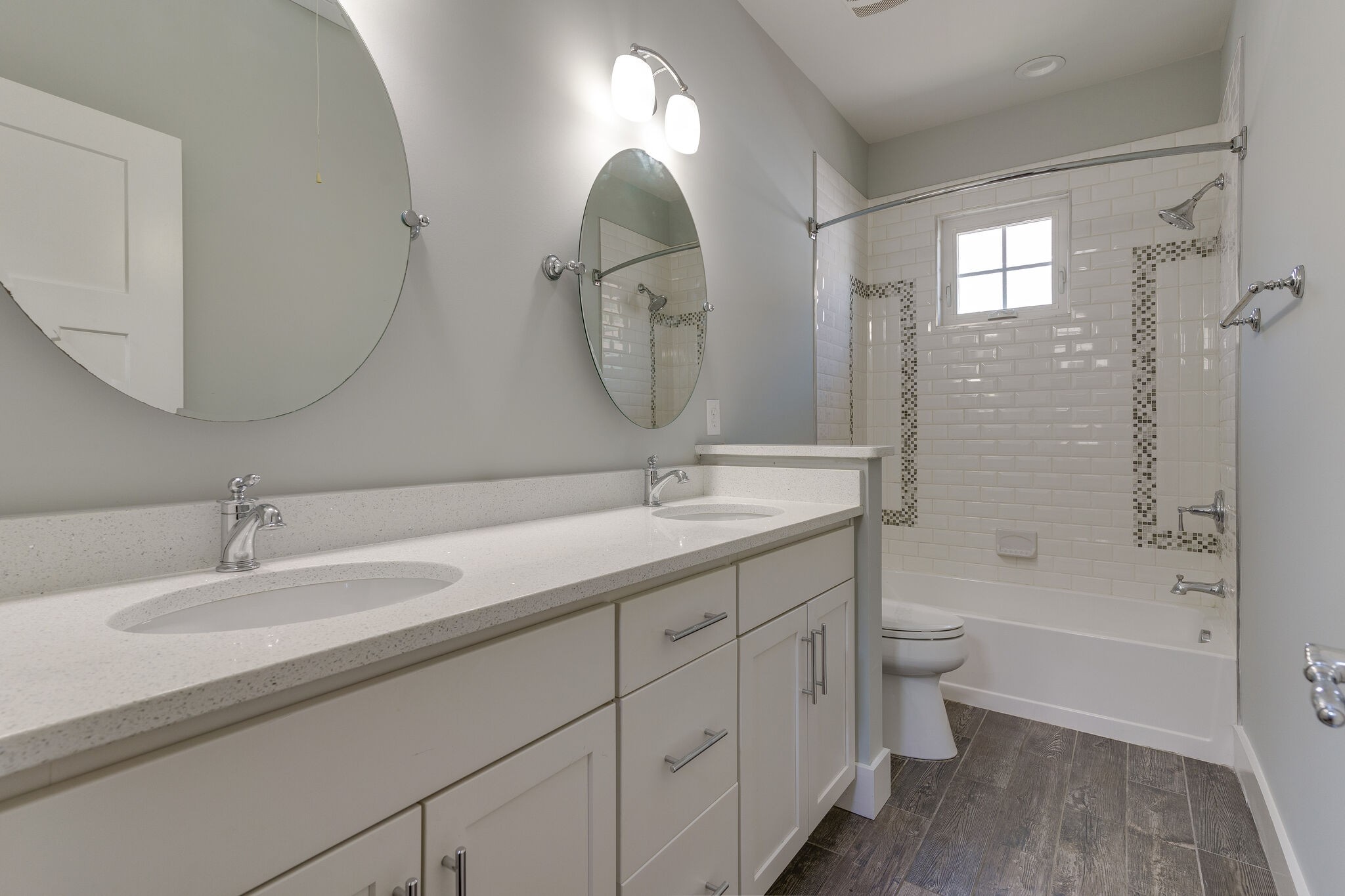 1711 Ridley Boulevard Nashville, TN 37203 - Photo 47 of 49 a bathroom with a double vanity sink mirror and bathtub