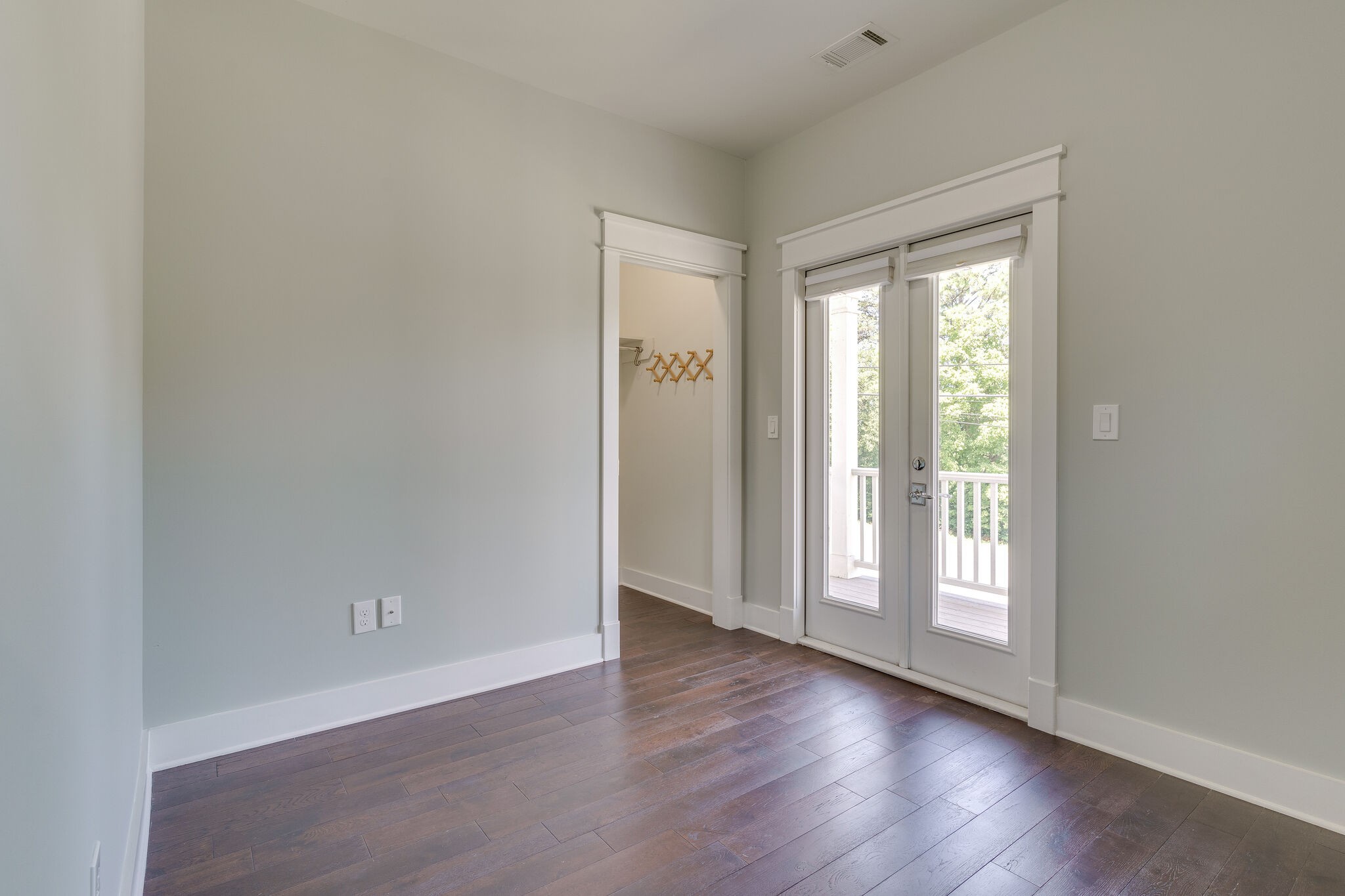 1711 Ridley Boulevard Nashville, TN 37203 - Photo 48 of 49 a view of an empty room with wooden floor and a window