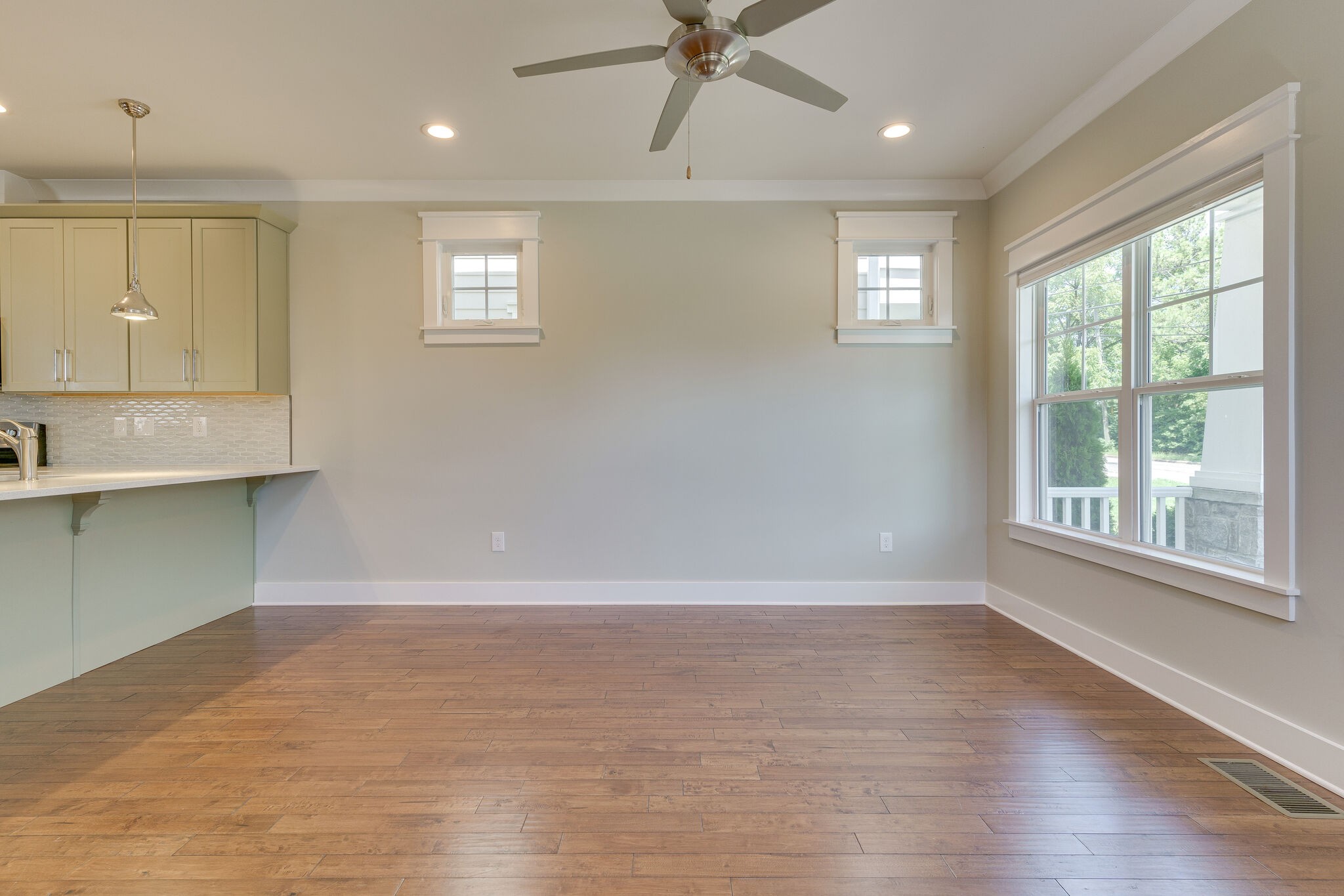 1711 Ridley Boulevard Nashville, TN 37203 - Photo 6 of 49 a view of an empty room with a window and wooden floor