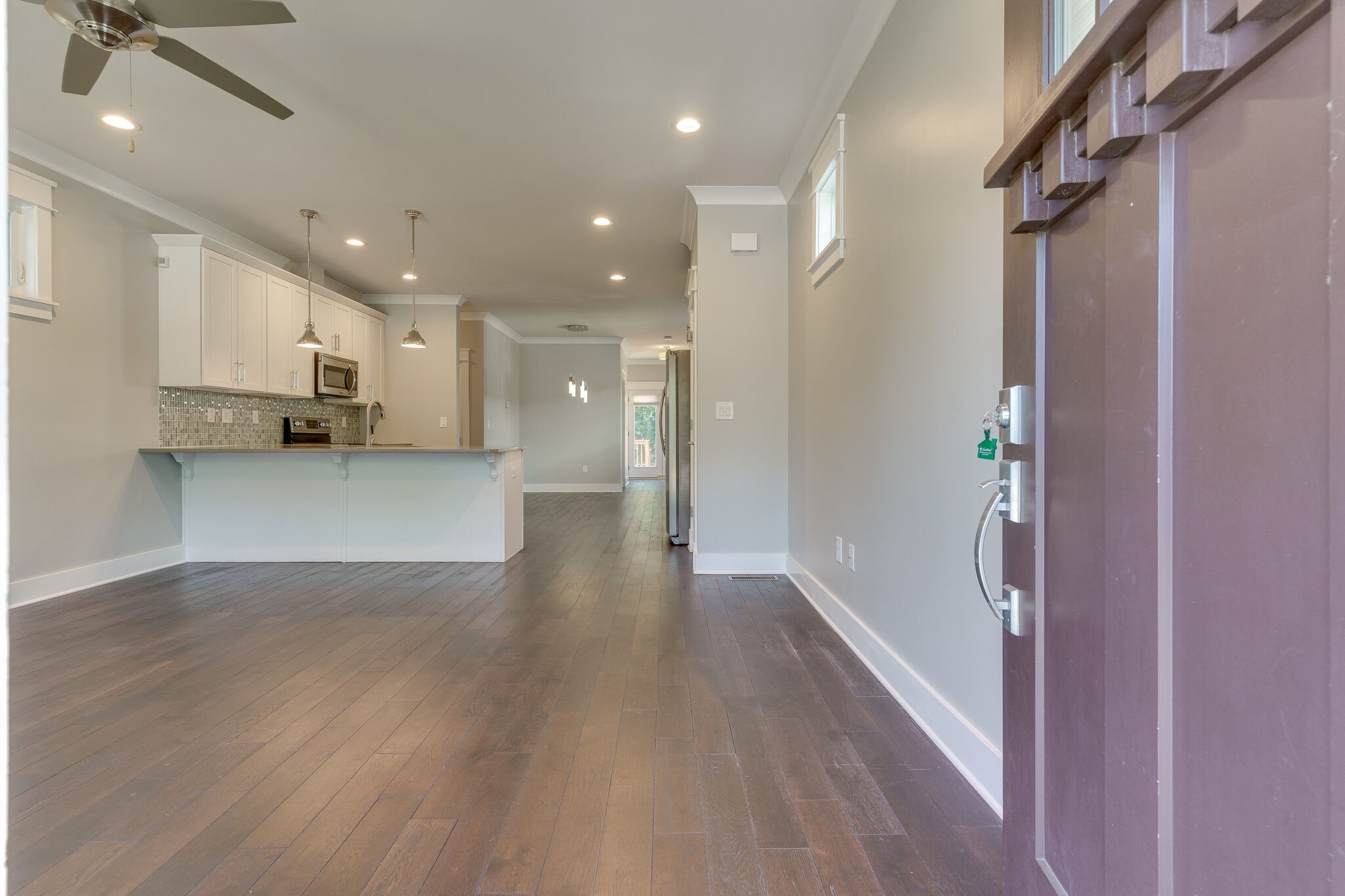 1711 Ridley Boulevard Nashville, TN 37203 - Photo 8 of 49 a view of a hallway with wooden floor and staircase