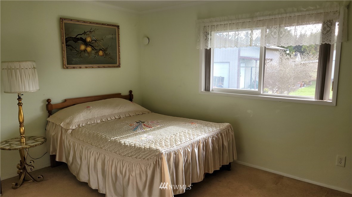 171 Mantle Road Sequim, WA 98382 - Photo 12 of 34 a bedroom with a bed and window