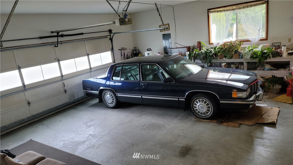 171 Mantle Road Sequim, WA 98382 - Photo 15 of 34 a car parked in a garage
