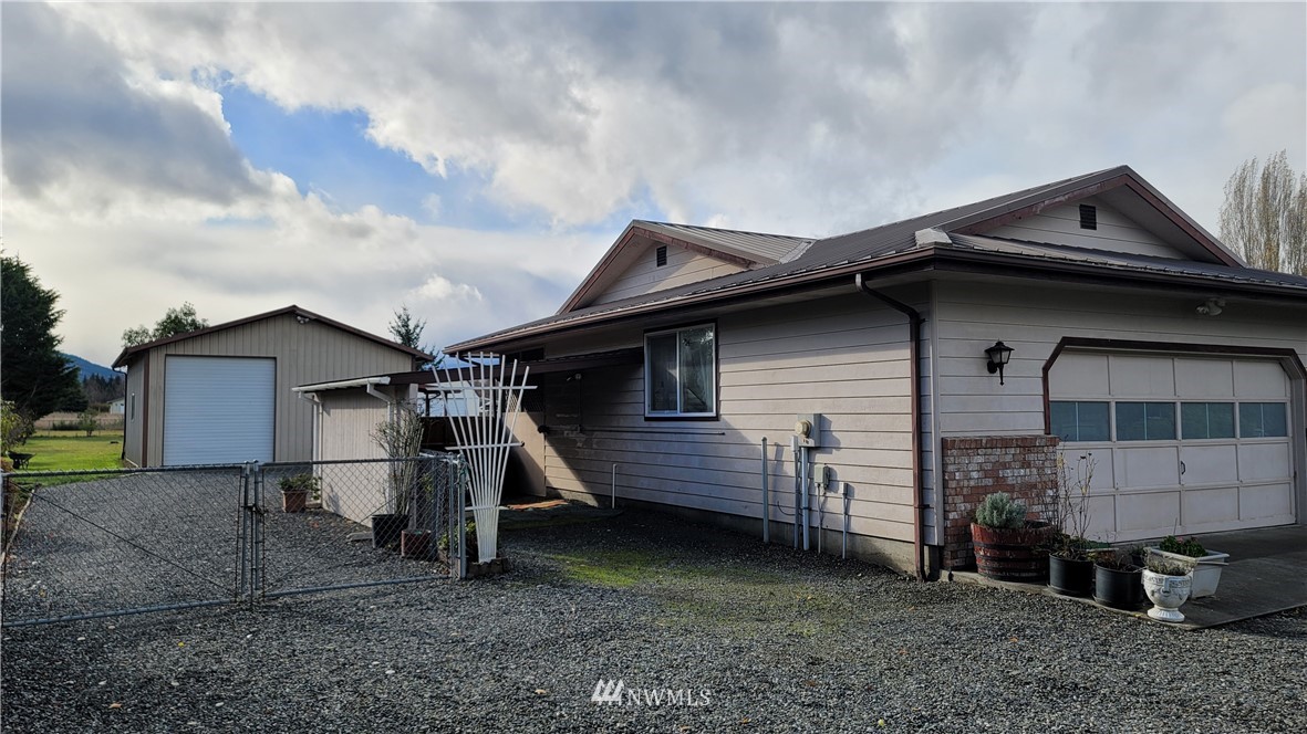 171 Mantle Road Sequim, WA 98382 - Photo 16 of 34 a front view of a house with a yard