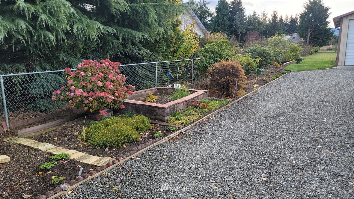 171 Mantle Road Sequim, WA 98382 - Photo 18 of 34 a view of a garden with a pathway