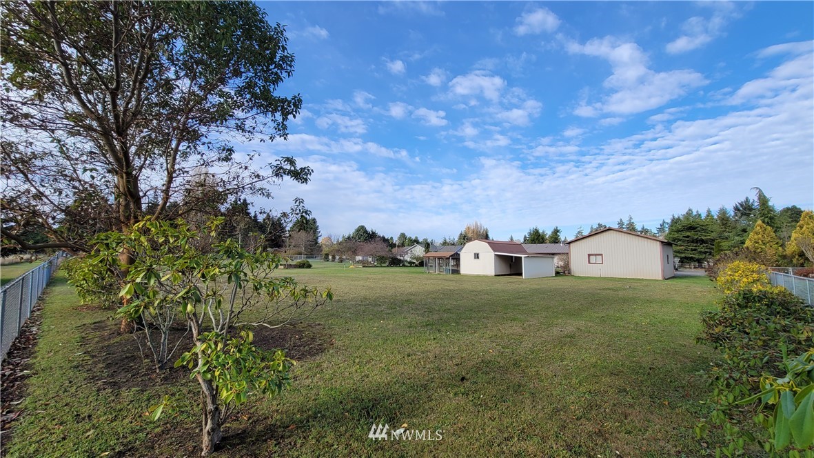 171 Mantle Road Sequim, WA 98382 - Photo 33 of 34 a view of a big yard with an trees and plants