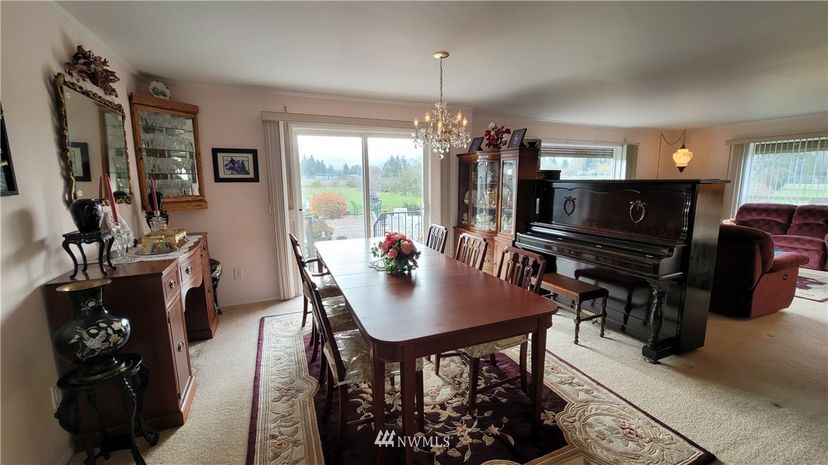 171 Mantle Road Sequim, WA 98382 - Photo 6 of 34 a view of a dining room with furniture and chandelier