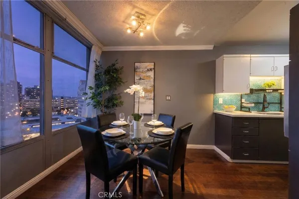 a view of a dining room with furniture and window