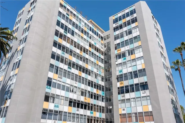 a view of a building with a yard