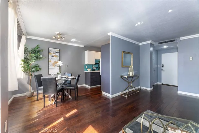 a view of a dining room with furniture and wooden floor