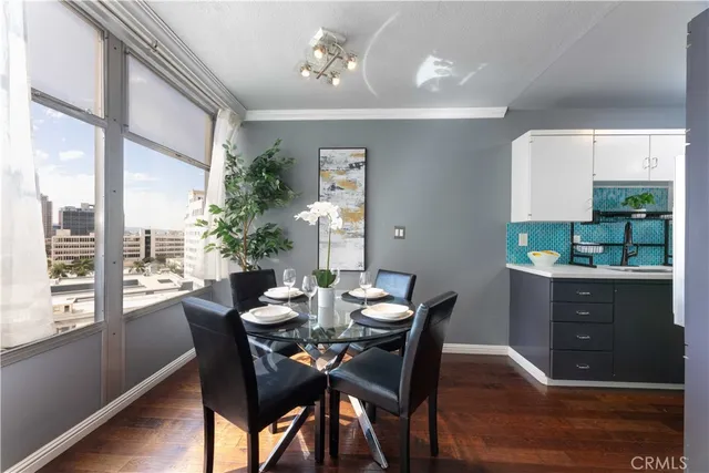 a view of a dining room with furniture window and wooden floor