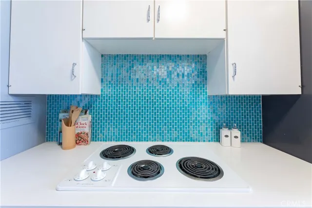 a kitchen with a stove and a microwave