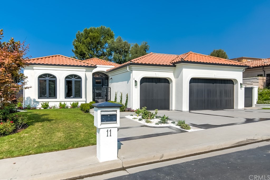 11 Marbella Dana Point, CA 92629 - Photo 1 of 50 a front view of a house with a garden