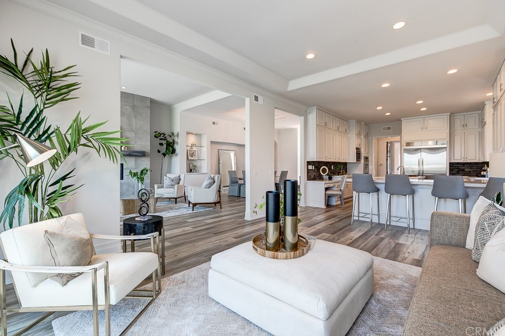11 Marbella Dana Point, CA 92629 - Photo 11 of 50 a living room with furniture kitchen view and a potted plant