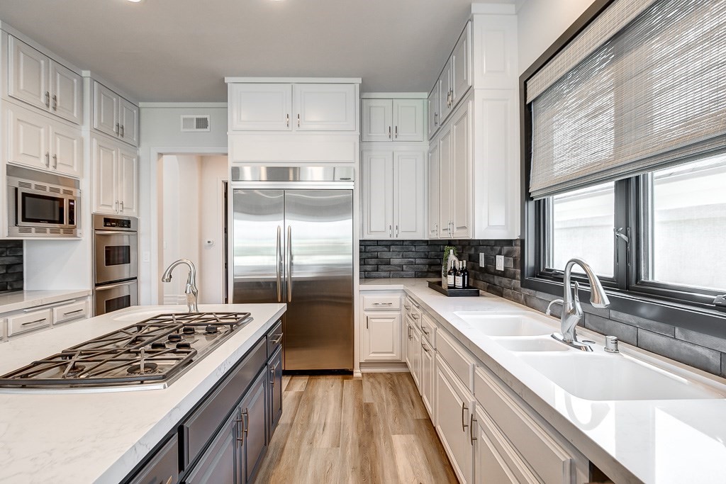 11 Marbella Dana Point, CA 92629 - Photo 16 of 50 a kitchen with a sink stove and refrigerator